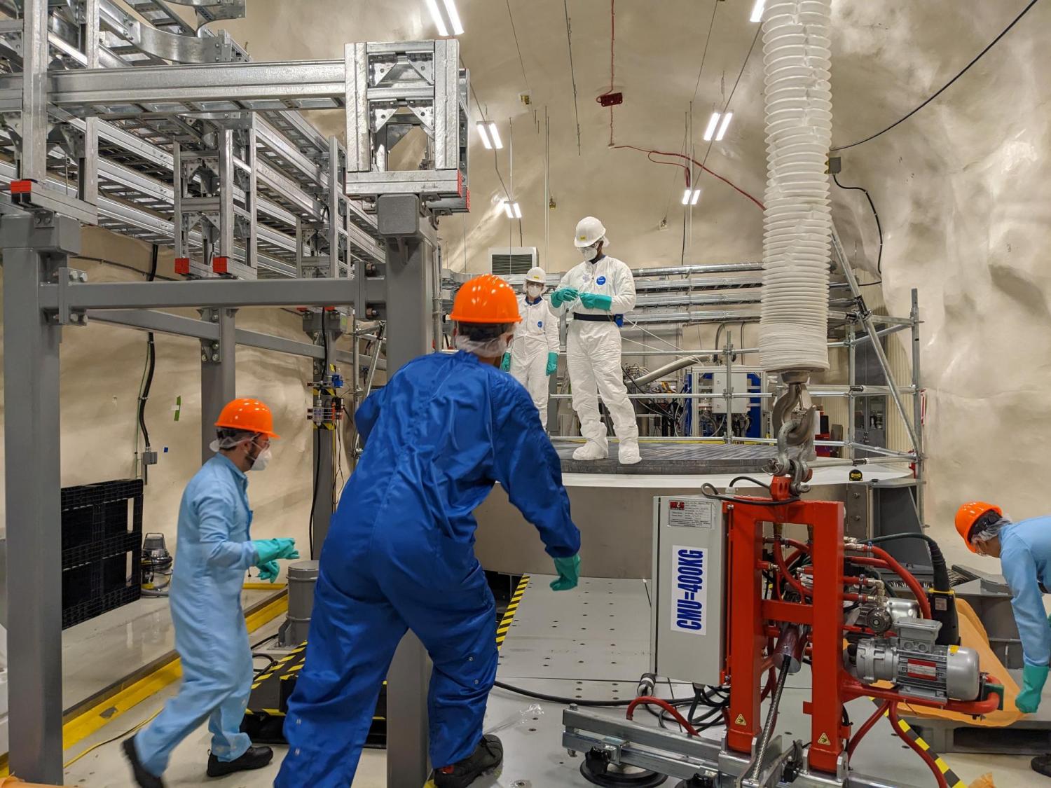 scientists work on the SuperCDMS dark matter lab