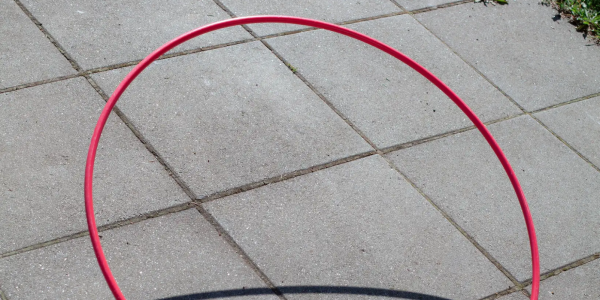 a hula hoop on a sidewalk