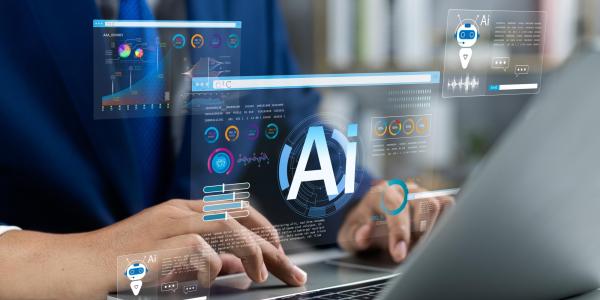 Person at laptop with floating AI graphics