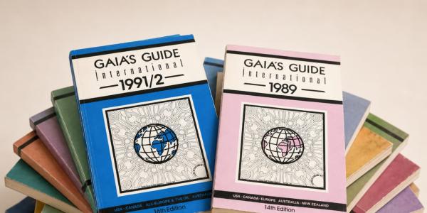 A stack of issues from Gaia's Guide, with the 1991/2 and 1989 editions on the top of the stack.