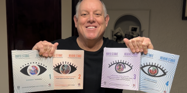 Dr. Otañez holding four books