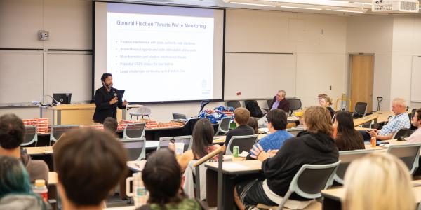 Paul Lopez speaks to classroom - wide shot