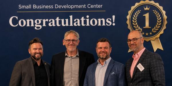 CU Denver Chemistry Professor Scott Reed (second from left) wins first place in AI pitch competition