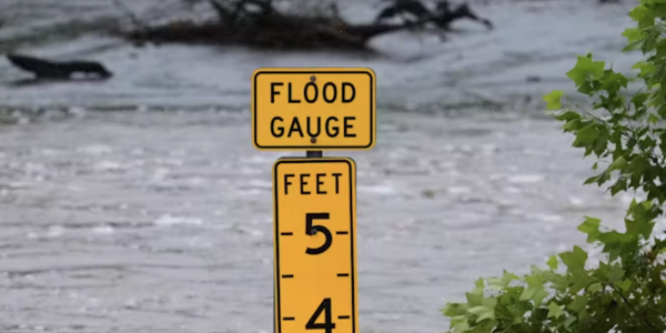 Image of flood level sign in water