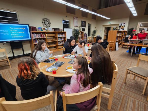 high school students sitting at table