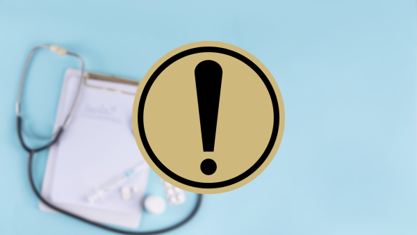 A blurred stethoscope in background with icon for alert in front