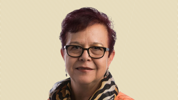 A headshot of Dr. Duran-Aydintug against a creme background