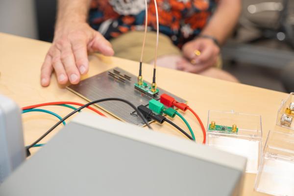 Martin's hand holds a piece of quantum tech