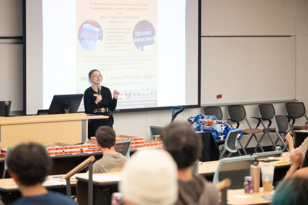 Representative from the CU Denver Student Government Association speaks to classroom