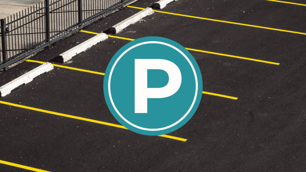 a parking lot with the symbol for parking over it