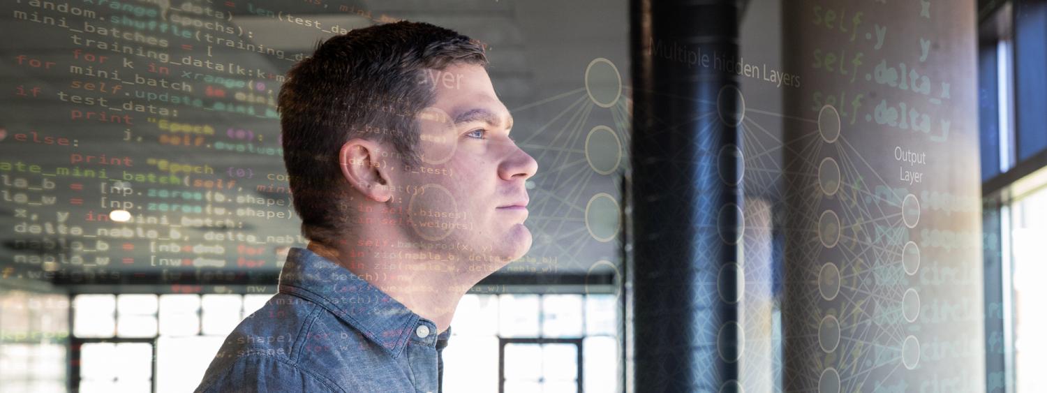 Philip looks out a window with data flying past him