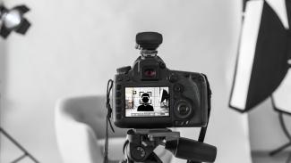 A photoshoot setup with icon of person to represent CLAS Professional Headshot Day