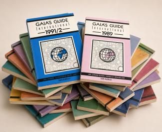 A stack of issues from Gaia's Guide, with the 1991/2 and 1989 editions on the top of the stack.