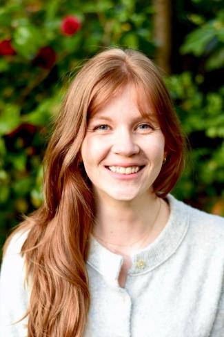 Laura Meyer, who was selected as a PEO Scholar, smiles in her headshot.