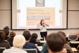 Common Cause representative speaks to classroom - wide shot