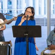 Musicians group sings to a crowd