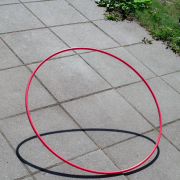 a hula hoop on a sidewalk