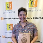 Rachel Gross holds Colorado Book Award