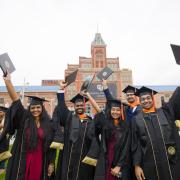 CU Denver students cheer at graduation