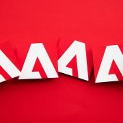The Adobe logo repeatedly spread across a background