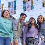 four CU Denver students in Larimer square smiling