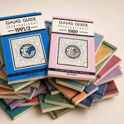 A stack of issues from Gaia's Guide, with the 1991/2 and 1989 editions on the top of the stack.