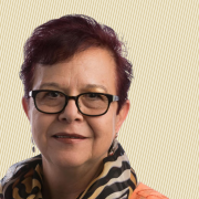 A headshot of Dr. Duran-Aydintug against a creme background