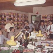Taiwanese citizens stand around table