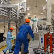 scientists work on the SuperCDMS dark matter lab