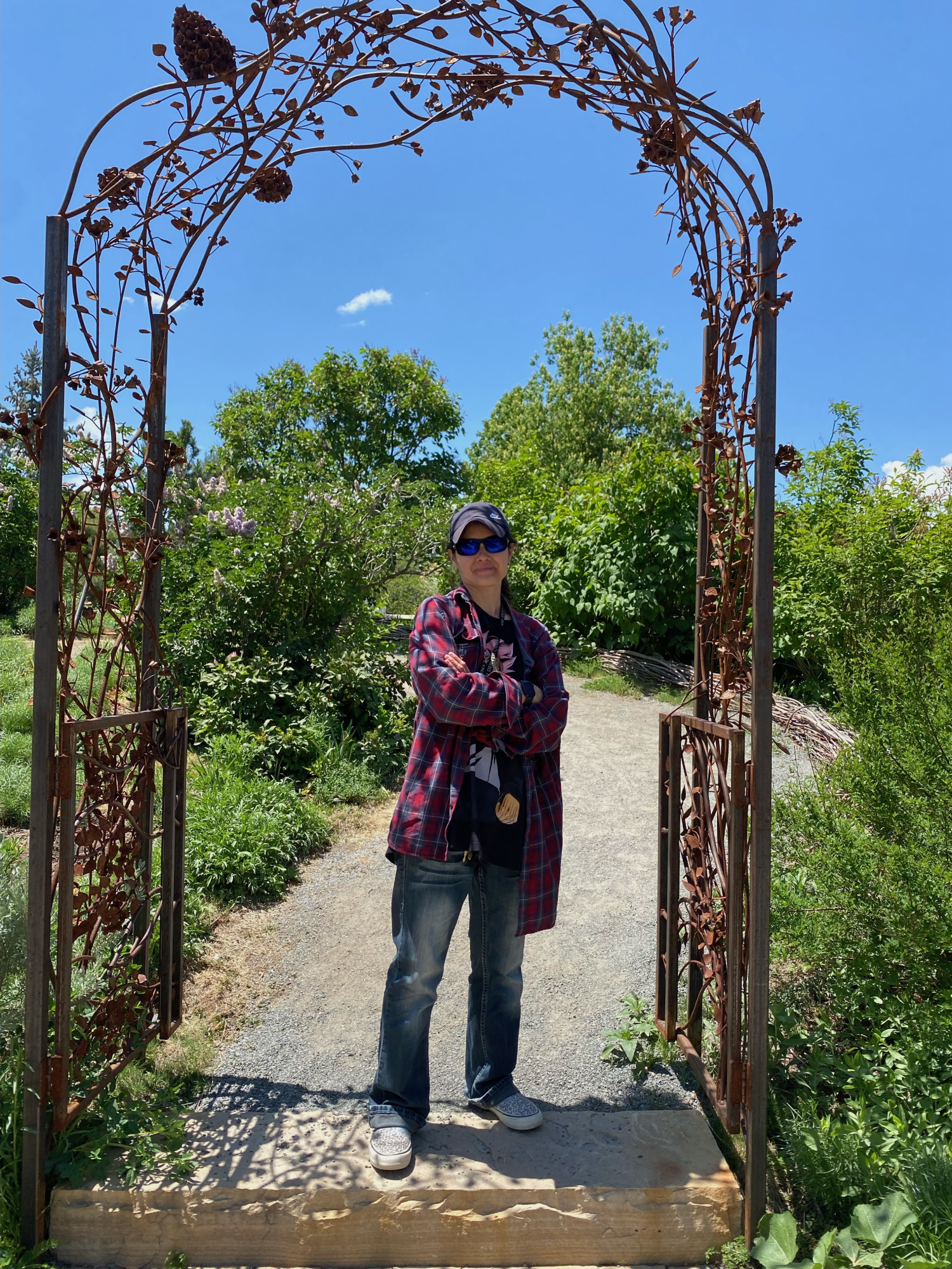 Photo of Kristina Jessen under arched garden gate