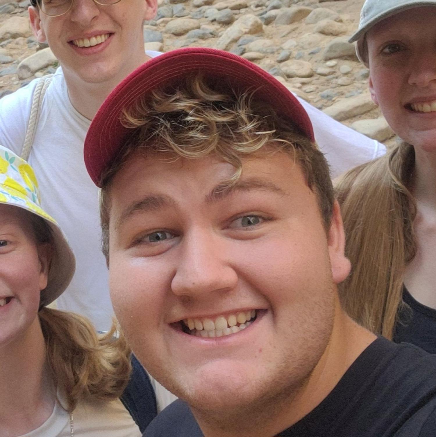 Photo of Grady Dietrich smiling and wearing baseball cap