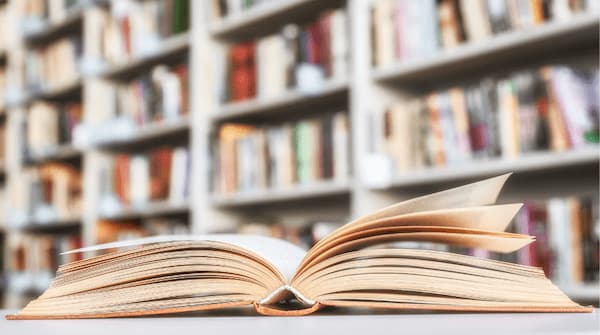 Picture of open book in a library