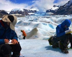Students taking notes at a glacier field in Patagonia.