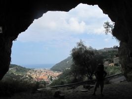 Riel-Salvatore and his son Mateo in a cave overlooking the town of Finale Ligure, Italy