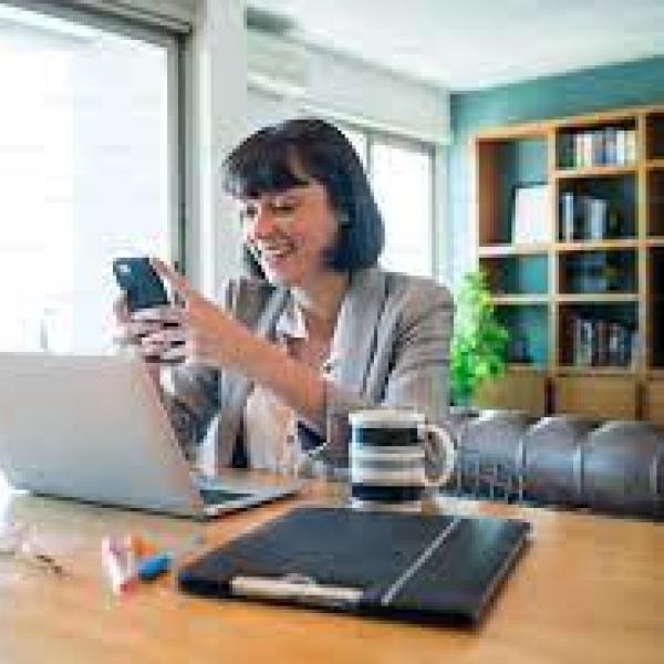 Women using computer and phone 