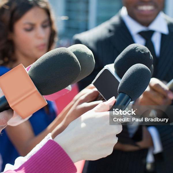 Man speaking into microphone 