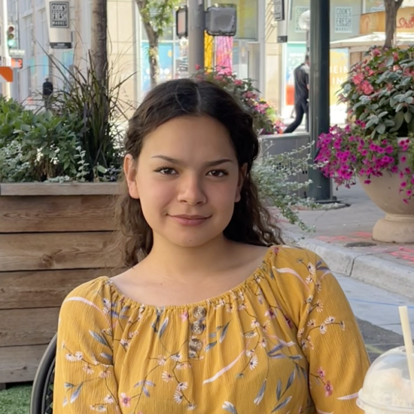 Photo of Ximena sitting at a table