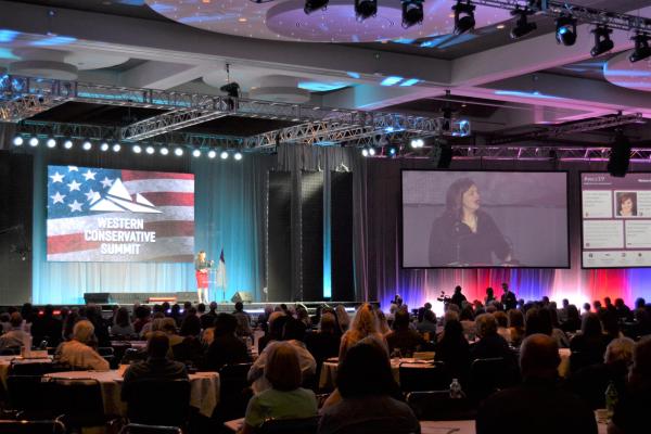 Abby Johnson speaks in front of a crowd at the Western Conservative Summit