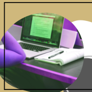 A decorative image with a student's open laptop and notebook with two circles in th background