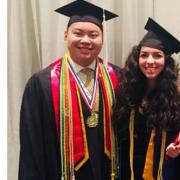 Johnnie Nguyen and Mena Hashim find President Bruce Benson during graduation ceremonies.
