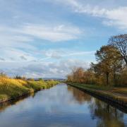 Canal with grass on either side