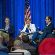 Robin Kniech moderating candidates for congressional and statewide offices.