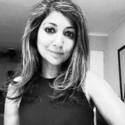 Black and white headshot of Betcy Jose