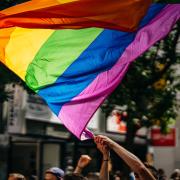 Rainbow pride flag being waved