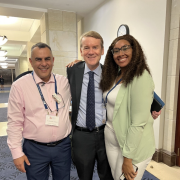 Ali Alnazzal with two other attendees, smiling