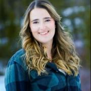 Head Shot of Political Science employee Kayla Spencer, smiling with long brown hair