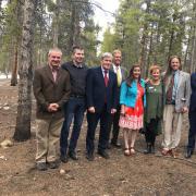 The photo shows Professor Walsh standing in Leadville's Evergreen Cemetery last May with Irish Ambassador Daniel Mulhall (red tie), Irish Consular General Adrian Farrell (green tie),  Leadville Mayor (standing in back), and members of the local Irish Network planning team.