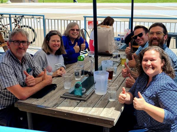 teachers enjoying time together at lunch outside