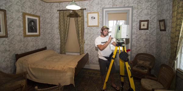 Addison using the Leica C10 to scan the room where Grant passed away