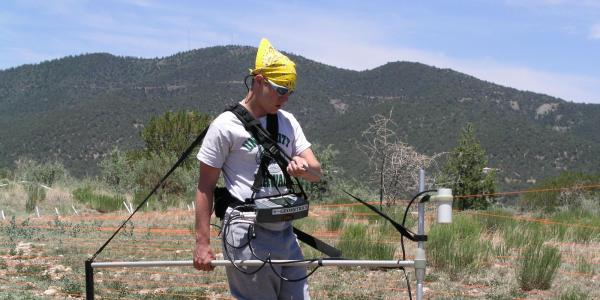 Kevin Faehndrich conducting magnetometer survey at Gila Encantada site, NM